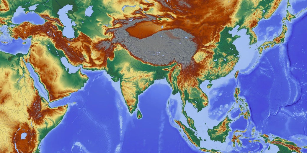 Topographic map of Asia and parts of the Middle East showing elevation through color gradients, with mountains, plains, and ocean depths clearly depicted.