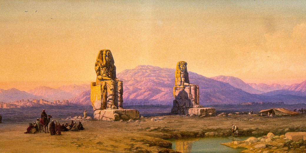 The Colossi of Memnon, massive statues of Pharaoh Amenhotep III, set against a mountainous backdrop. Travelers and locals are seen resting nearby, with a warm sunset casting a golden glow.