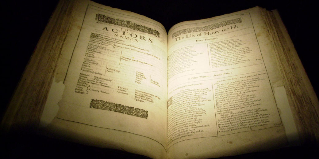 An illuminated page from Shakespeare’s First Folio, featuring the cast list and opening of Henry V. The historic book preserves the playwright’s works in their original 17th-century form.