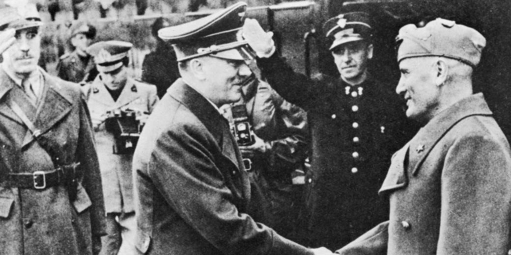 Axis leaders Adolf Hitler and Benito Mussolini take an apparently friendly leave of each other