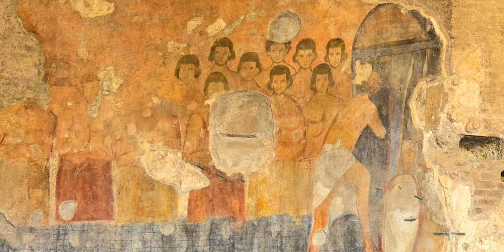 Ancient fresco shows a group of people watching a man with a spear enter through a door; parts of the artwork are weathered and missing.