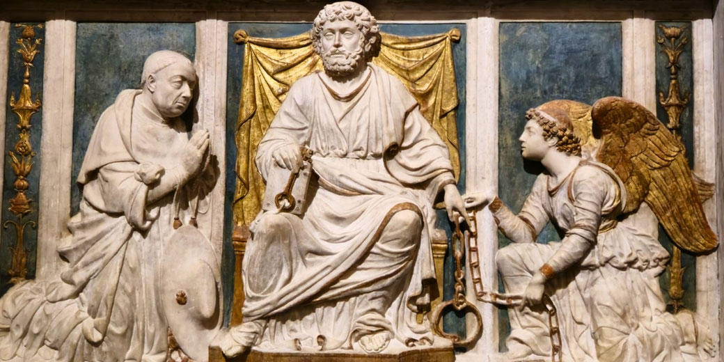 A marble relief shows a seated figure holding keys, flanked by a kneeling monk and an angel with golden wings, symbolizing a religious or papal authority.
