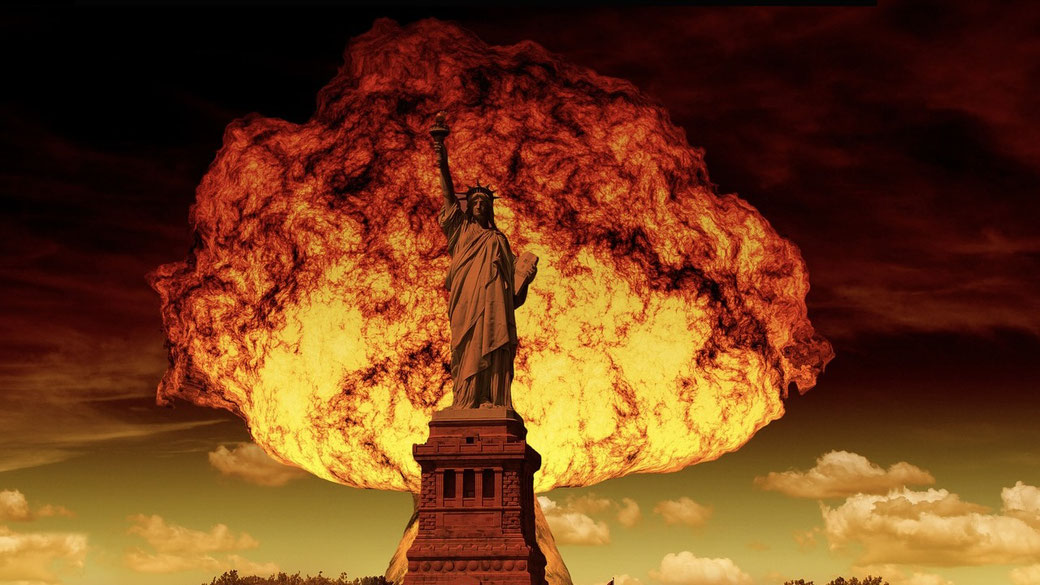 The Statue of Liberty stands in front of a massive explosion, with a fiery cloud engulfing the sky in a dramatic, apocalyptic scene.