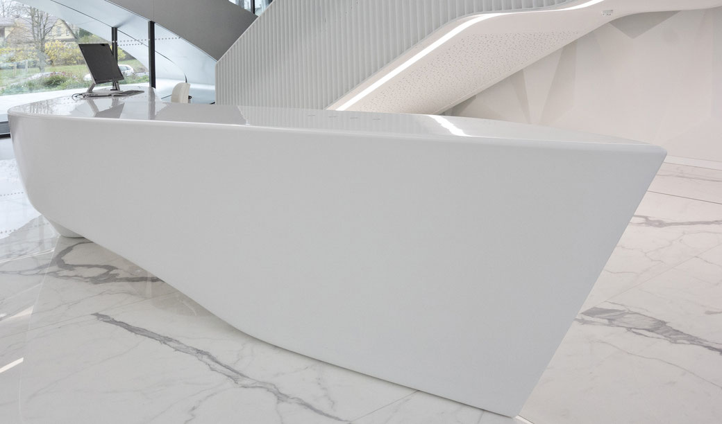 Sculpture-like solid surface reception in the foyer of a business centre in Vilnius is a true work of art 