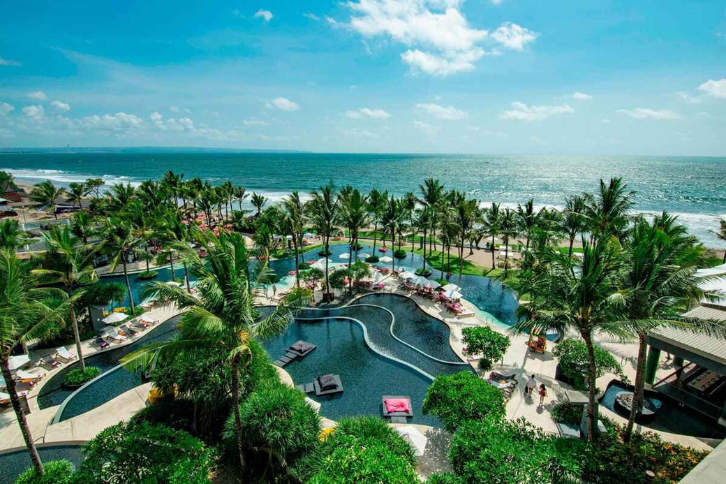 Tropical garden view from W Hotel with pools stretching toward the beach and ocean.