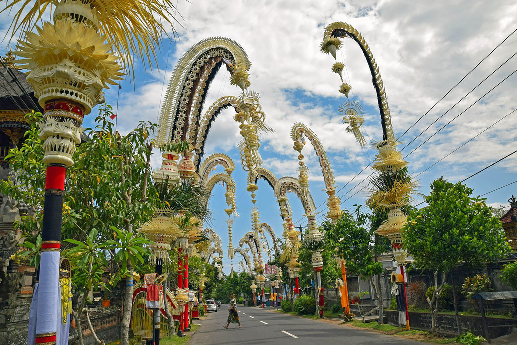 Street full with Penjors during Galungan ceremony in Bali