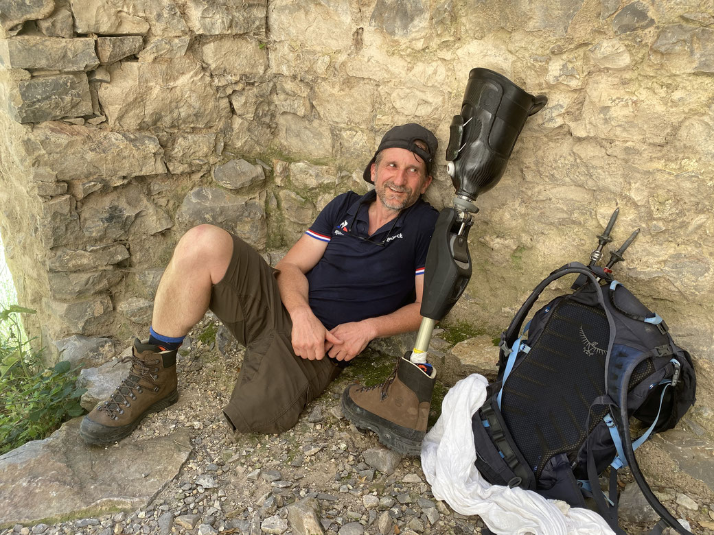 Taking a break in the shade during a hike in the Pyrenees on a hot summer day.