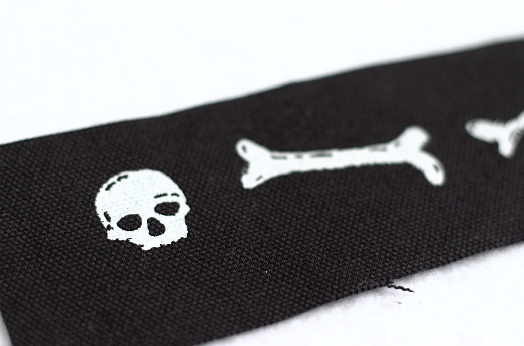 Skull and Bones patch, white ink screen-printed on black organic canvas by Zebraspider Eco Anti-Fashion