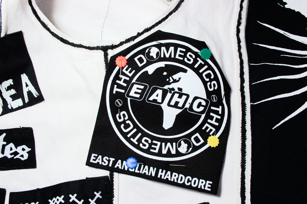 5 ways to sew on patches - pin patch onto vest - Zebraspider Eco Anti-Fashion Blog
