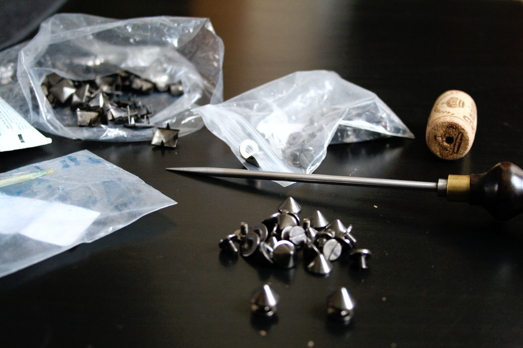 Update on the not-so-white-anymore punk vest - gunmetal black screw studs, pyramids and awl - Zebraspider Eco Anti-Fashion