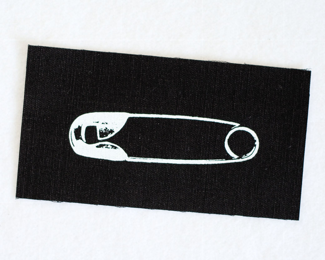 What's new with the patches? - organic cotton safety pin patch white on black - Zebraspider DIY Anti-Fashion Blog