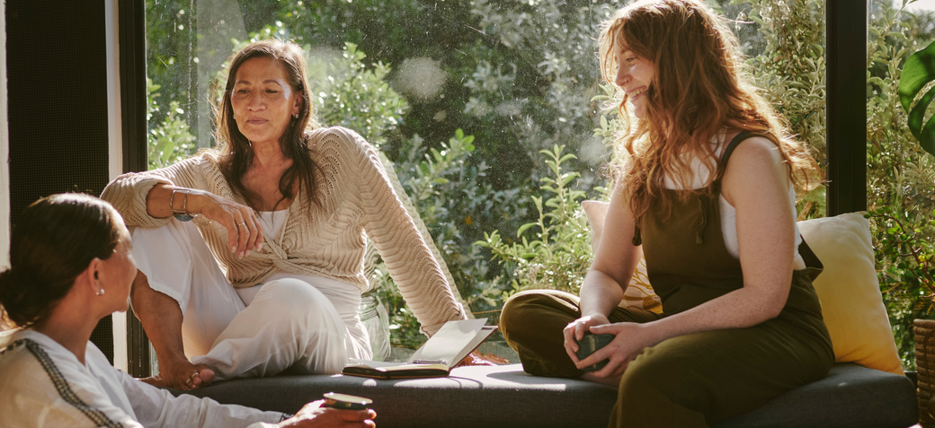 Women chatting in a group on a private yoga retreat