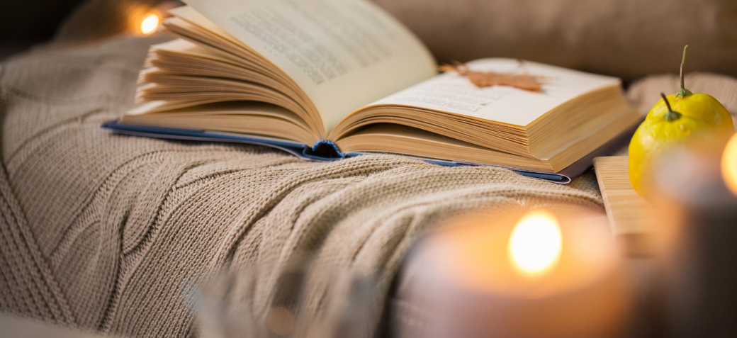 A book and blanket during a relaxed afternoon on a private yoga retreat with Julia Poole