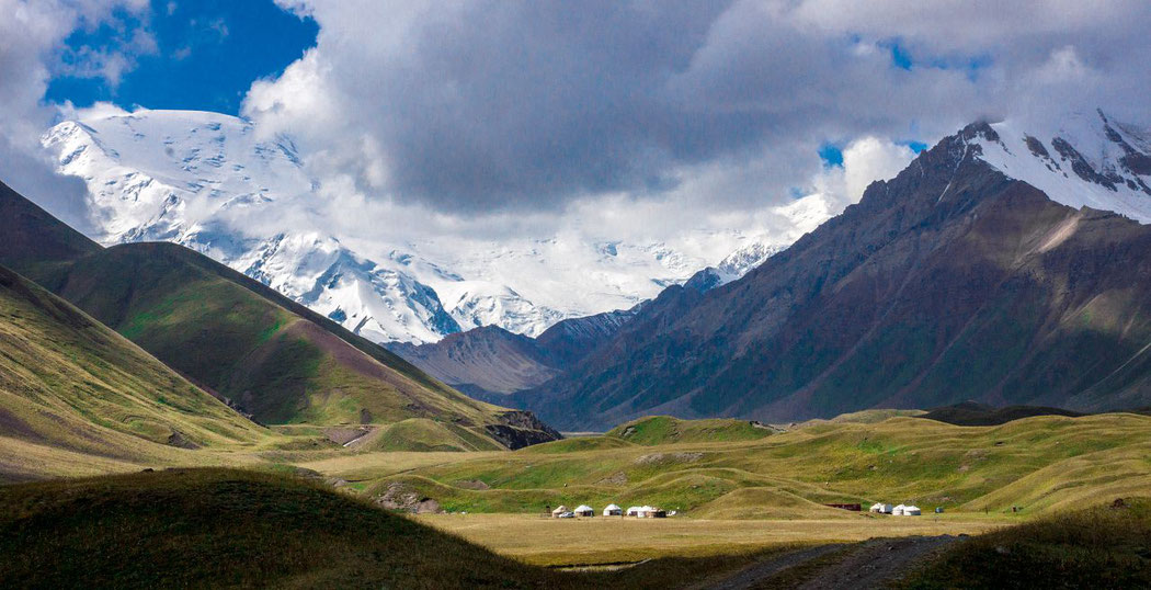 Kyrgyzstan: view of the Lake Tulpar-Kul, Behind the Lenin Peak in Tajikistan