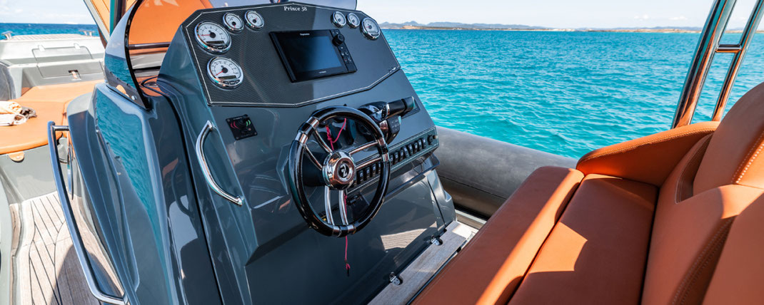 cockpit of a luxurious tender boat, leather seats, blue waters in the back