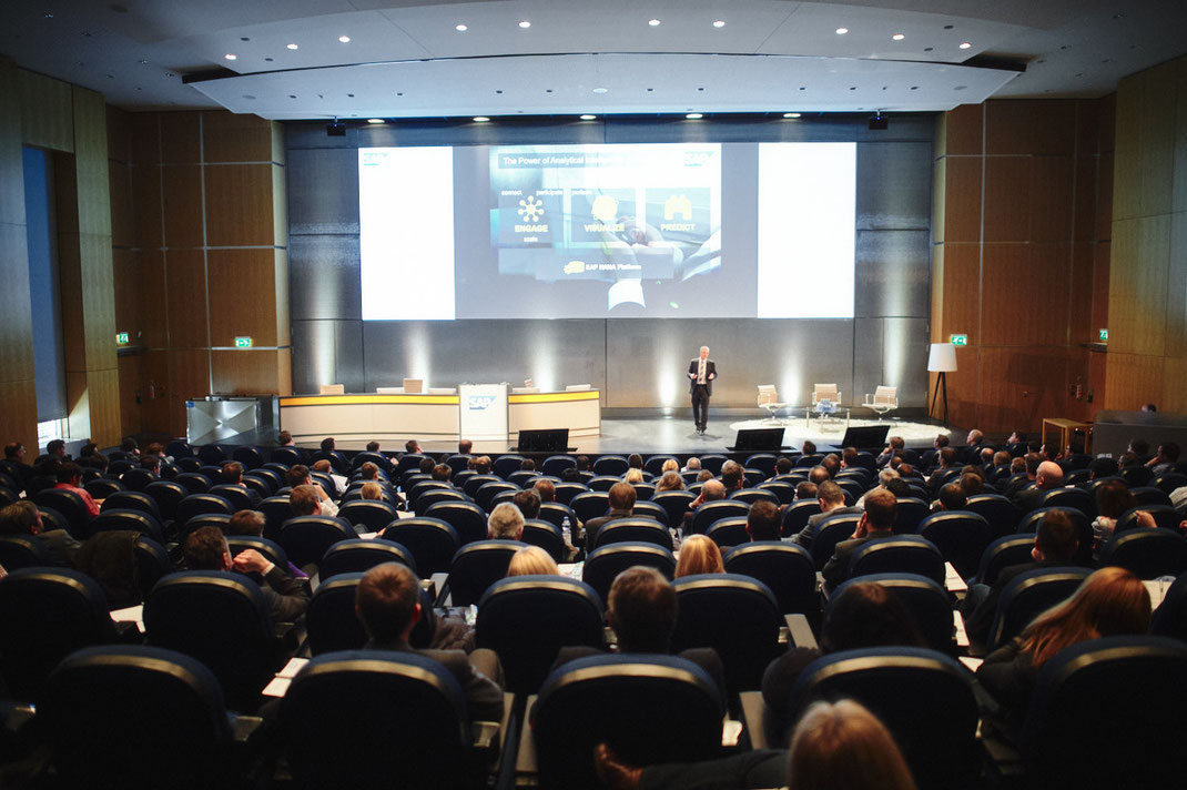 WINDHOFF SOFTWARE SERVICES: Speaker and audience during a corporate event, captured as part of the event photography.