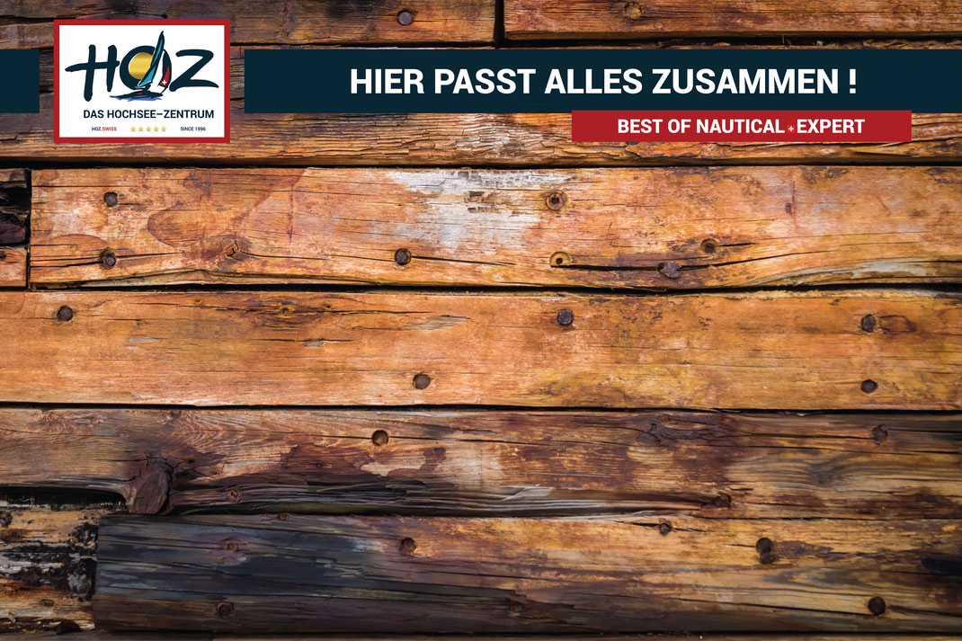 Schiffsplanken die fest aneinander liegen mit der Aufschrift HIER PASST ALLES ZUSAMMEN und HOZ Logo