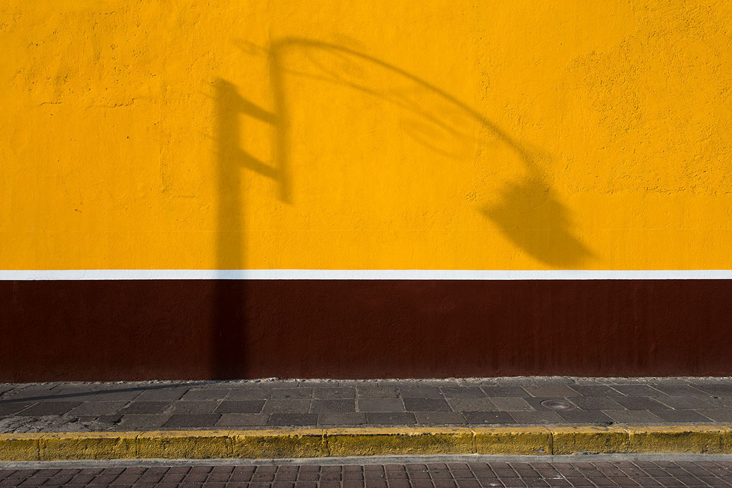 Yellow wall with abstract lamp shadow, Pueblo, Mexico, 1280x853px