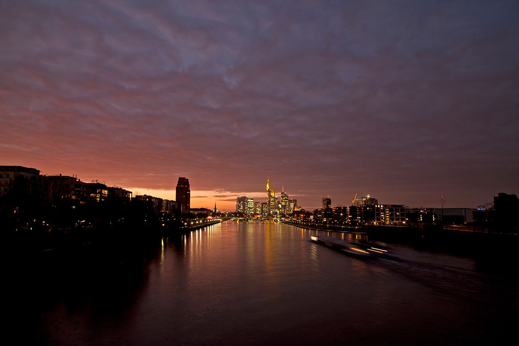 Illuminated Frankfurt Skyline with Main river and dramatic colored sky, sunset, Long Exposure, 1280x853px