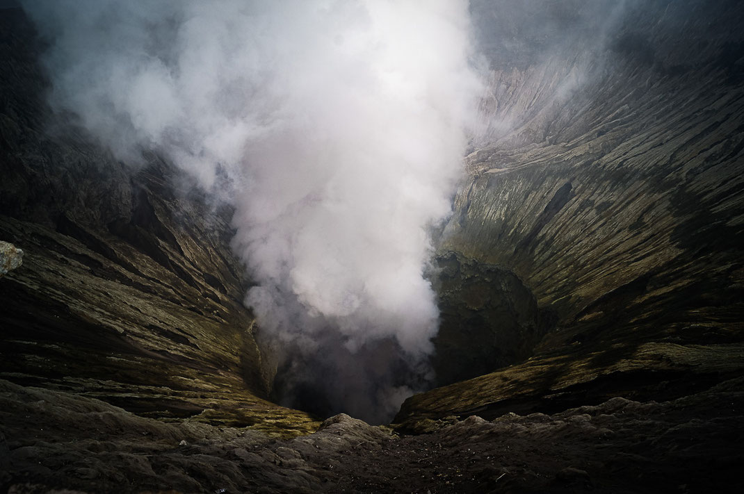Mouth of Gunung Bromo with rising smoke.