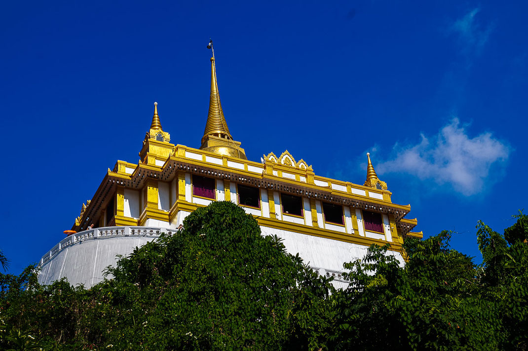 The Golden Mount under a bright blue sky.