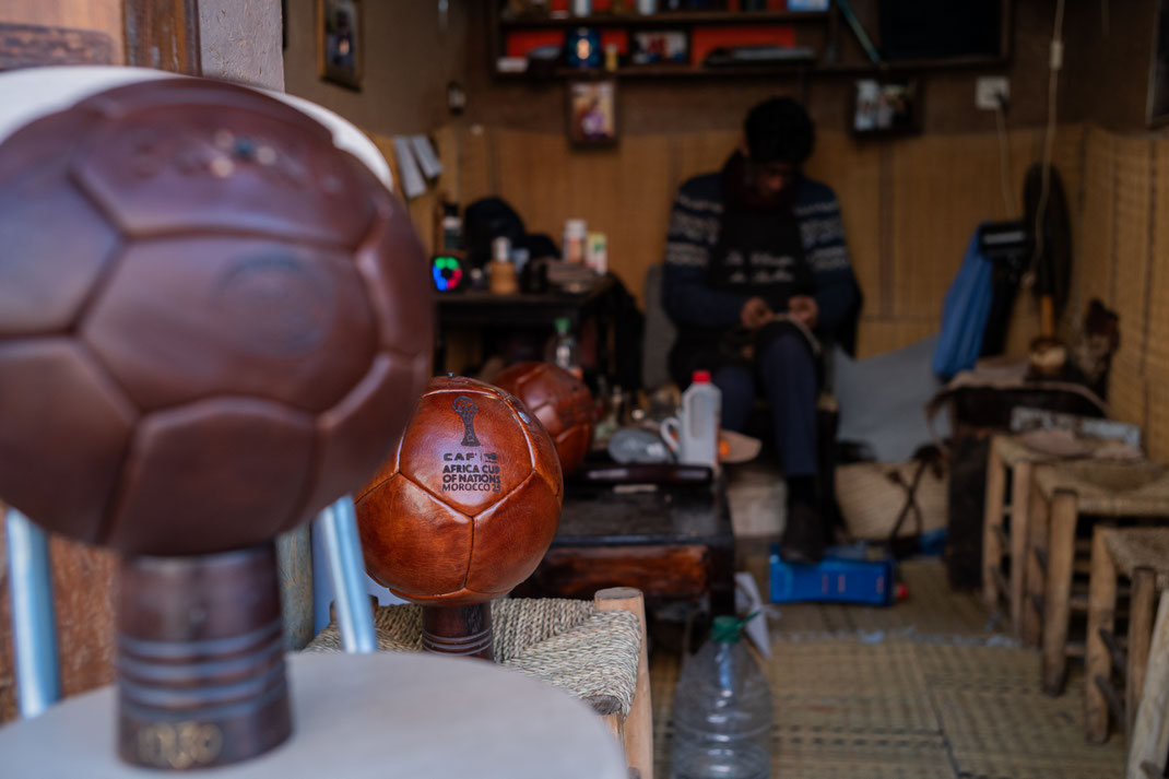 Kamal Boukentar handcrafting a football ball at La clinique du ballon - Marrakech Morocco