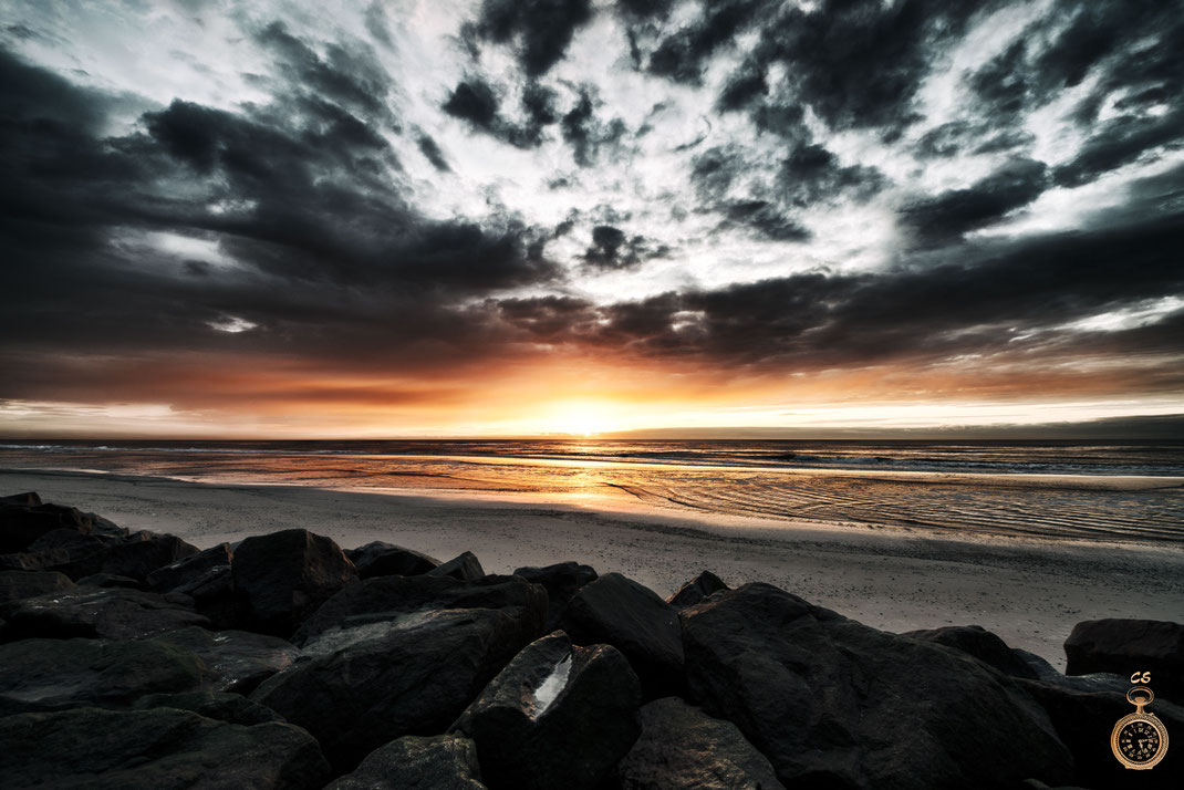 Waves against a fantastic sunset
