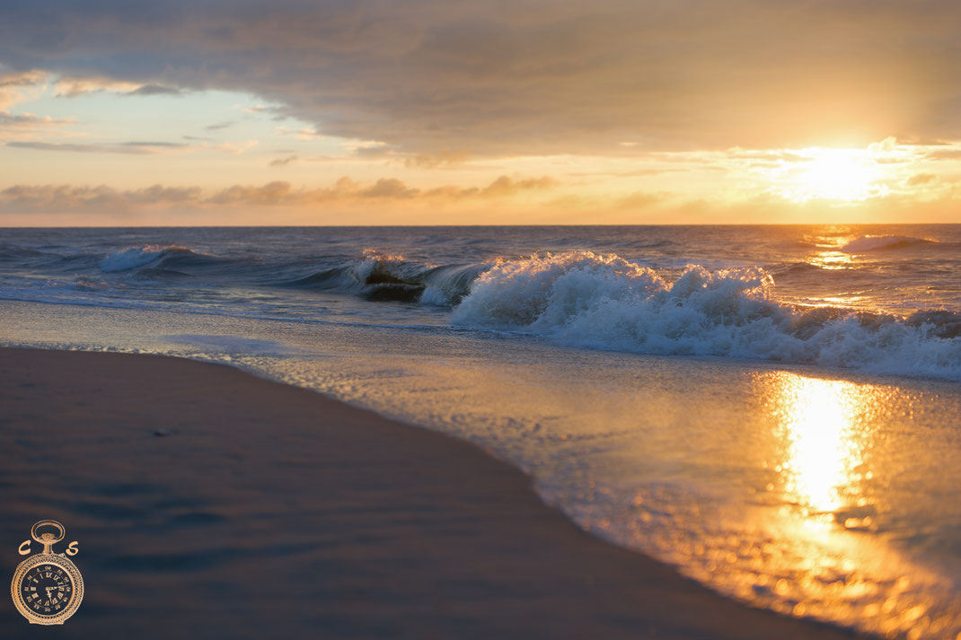 Waves against a fantastic sunset