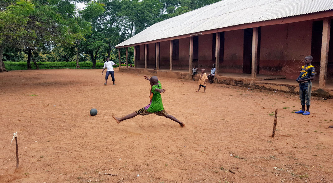 Daily football practice in front of a school building in Sang, Northern Ghana (© Phedon Konstantinidis)