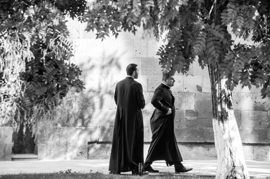 Armenia. Two spiritual in the court of  Mother Cathedral of Holy Etchmiadzin