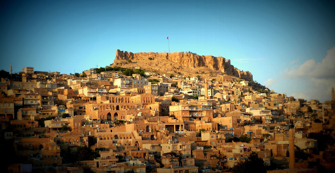 #  Mardin. The city is located on the slope of a hill looking down south to the Mesopotamian plains. According to a hearsay, the history of the city dates as far back as the Flood. 