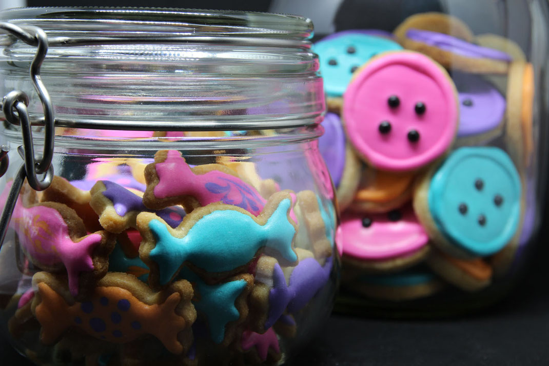 cookie jars with funny candy shaped cookies and button cookies