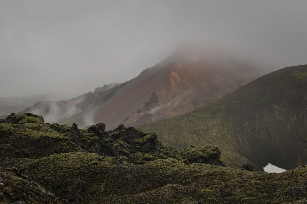 Brennisteinsalda in the fog, with lava and moss in the foreground. 