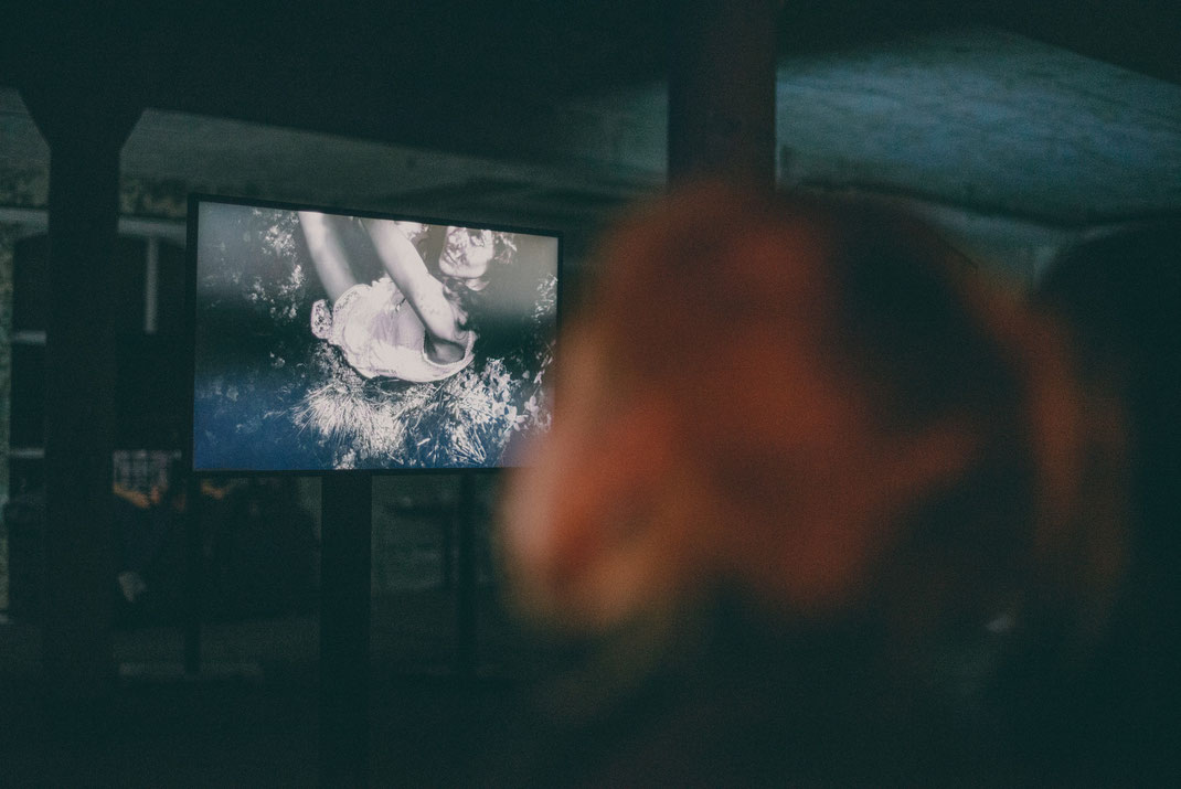 a contribution: a monitor showing a black & white image of girl in a white dress