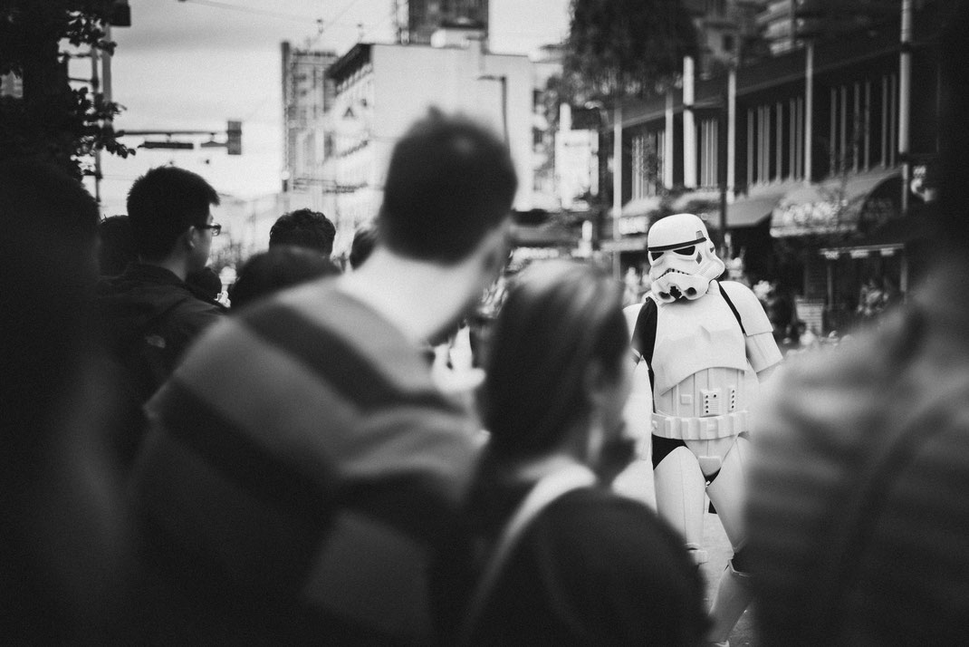 a stormtrooper walking on a Halloween parade
