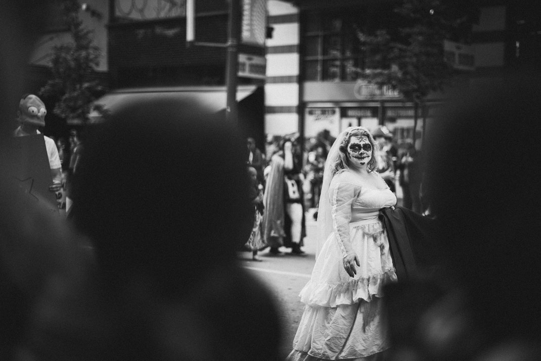 a creepy bride walking down the Halloween parade