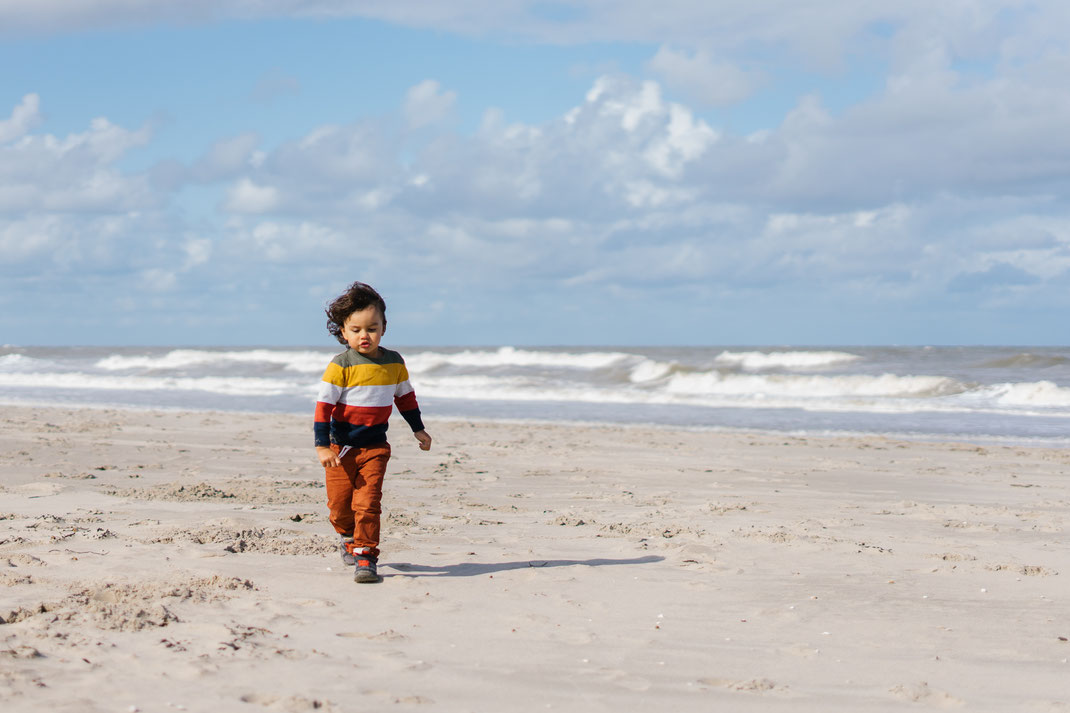 boy walking on the beach