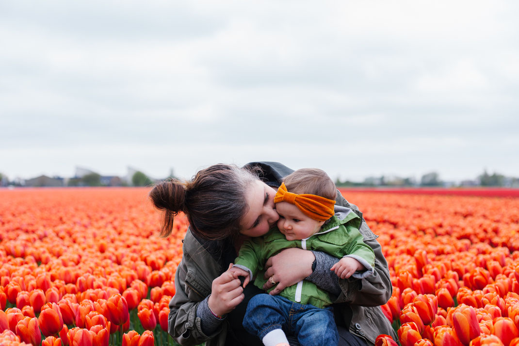 Baby and mom in the tulip fields