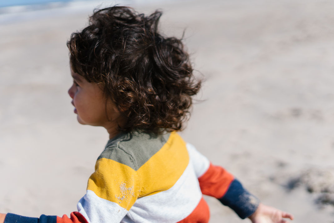 closeup of a boy in a striped shirt