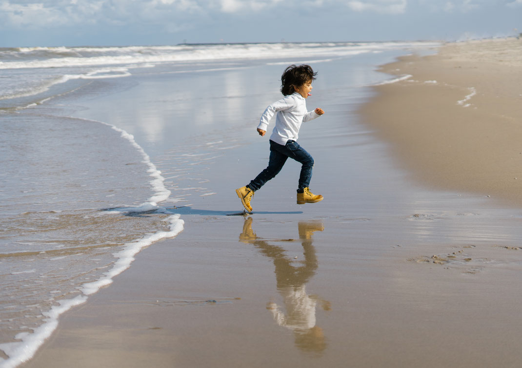 running boy on the beach