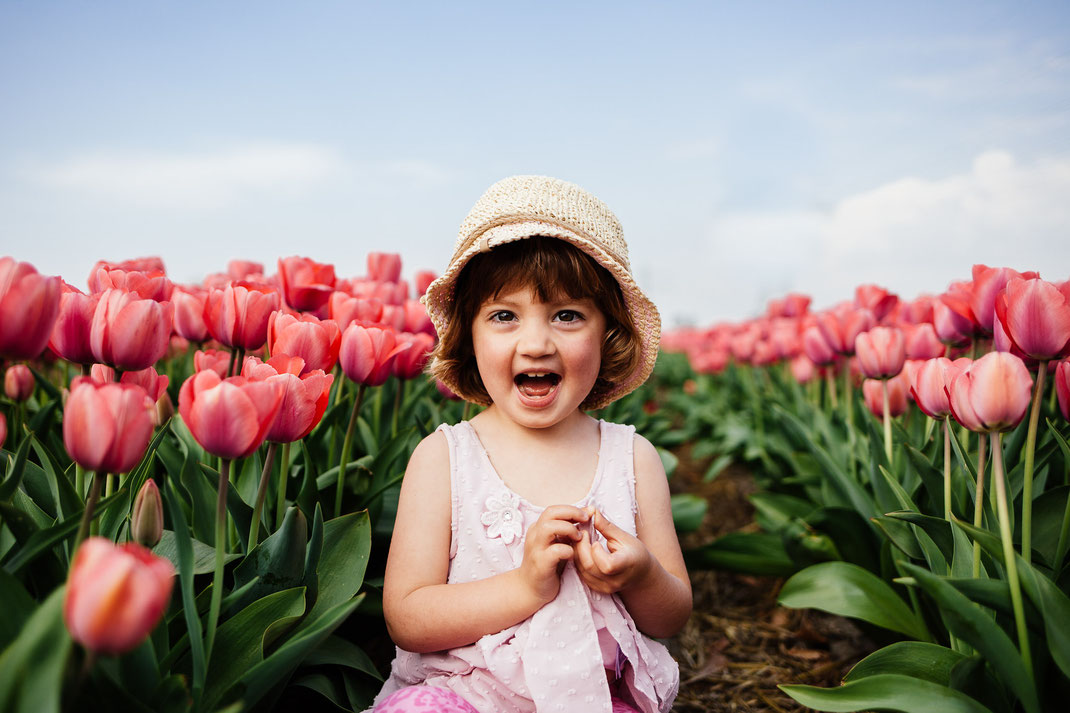 Little girl in the tulip fields