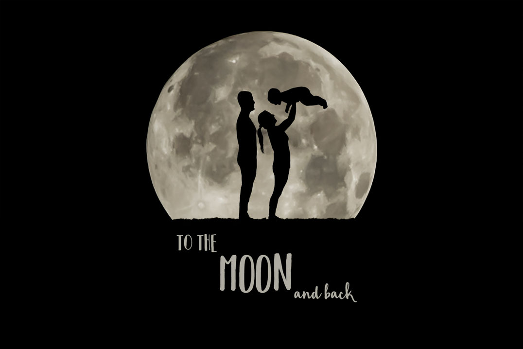 Male and female couple holding a bay in front of a large full moon. Family is in silhouette. Mom is holding baby. Dad is standing behind mom.