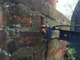 badly fitted satellite dish on a chimney, fitting a dish on a chimney, screws and plugs