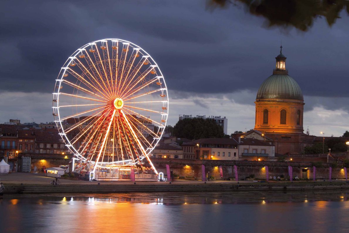 Most beautiful ferris wheels in Europe - Big wheel at night with lights and the dome, Toulouse, France Copyright Monica Mayayo V