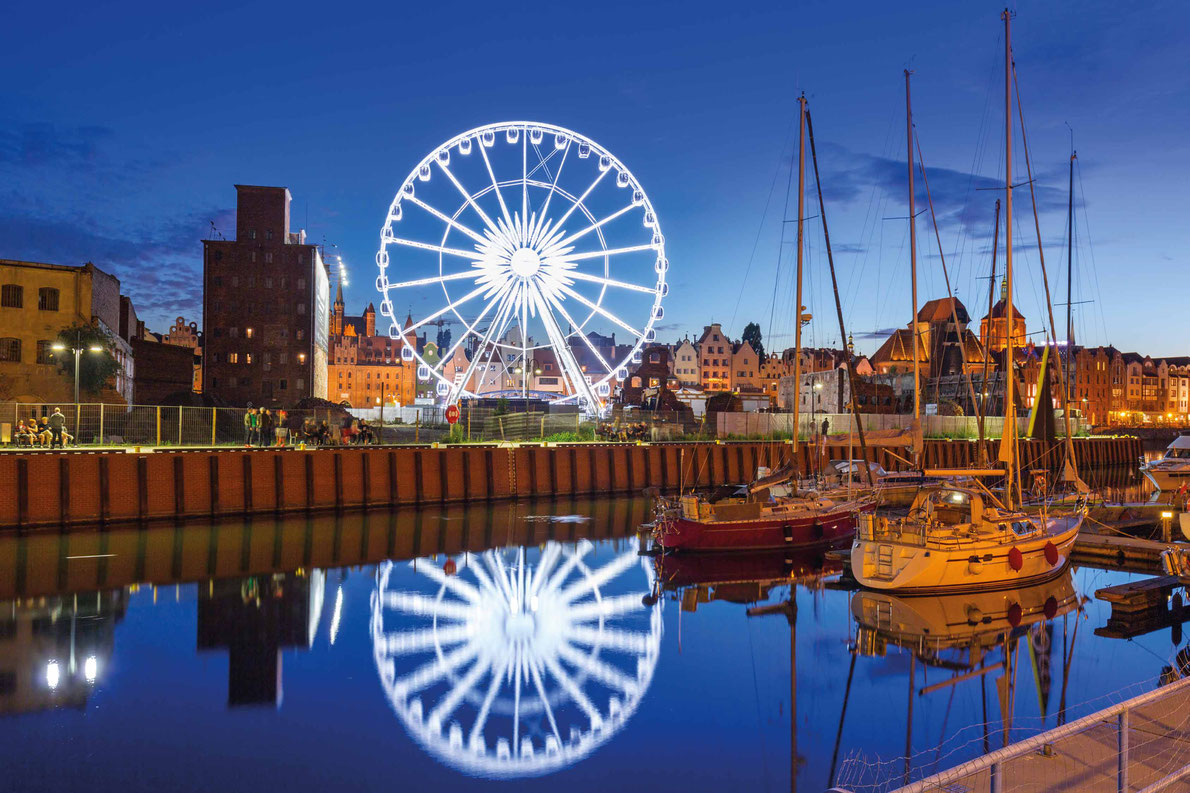 Most beautiful ferris wheels in Europe - Ferris wheel in the old town of Gdansk at night Copyright Patryk Kosmider