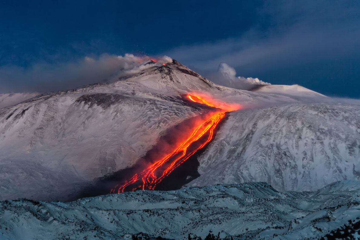 Most beautiful landscapes in Europe  - Volcano Etna Eruption - lava flow through the snow Copyright Wead