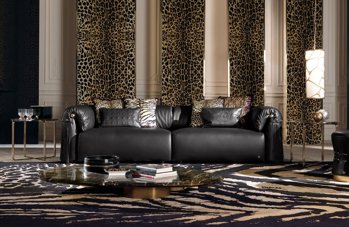Malawi sofa by Luca Tornaghi for Roberto Cavalli Home, leather sofa with sculptural armrests, fringe detailing and gold accents