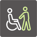 Ein Icon mit einem Rollstuhlfahrer und einem Betreuer wird gezeigt