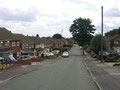 Park Farm Road - 1960s and 1970s housing typical of the area. © Copyright David Stowell and licensed for reuse under Creative Commons Licence Attribution-Share Alike 2.0 Generic. Geograph OS reference SP0595. For a link to Geograph go to Acknowledgements.