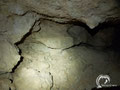 The main room of the cave has 7 small chambers and several big rocks in the centre. 